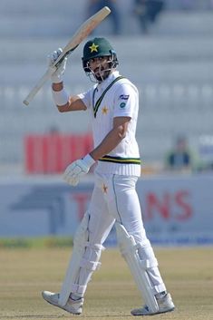 Shan Masood, Pakistani cricketer, focused at the crease during a Test match, showcasing his stylish and composed batting technique.